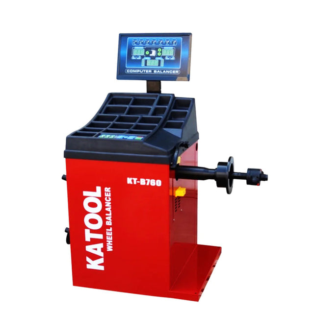 The red Katool KT-B760 wheel balancer with a digital screen and a vertical shaft on a white background.