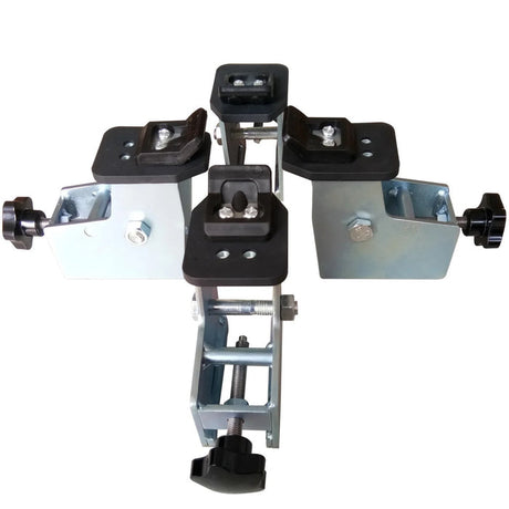A comprehensive view of the four-piece Katool Motorcycle Adaptor for Wheel Clamp Tire Changer MC1 laid out to showcase its functionality. The heavy-duty silver metal clamps, each equipped with a black, easy-grip knob, are designed to securely mount motorcycle wheels onto a tire changer's table, providing a stable platform for safe service.
