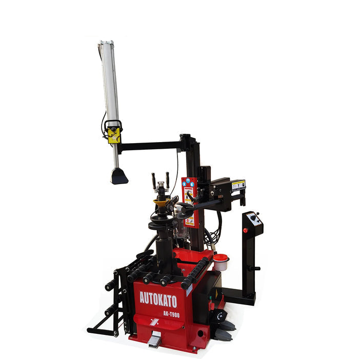A wide shot of the red Katool Center Post Tire Changer Machine KT-T900, with two inset diagrams highlighting the hydraulic cylinder's movement and the manual operation of the turntable mounting head.