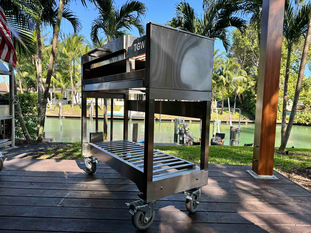 Tagwood BBQ Argentine Wood Fire & Charcoal Gaucho Grill BBQ18SS Stainless Steel Freestanding Grill with Shovel Poker & Heavy-Duty Casters for Mobility PRE-ORDER
